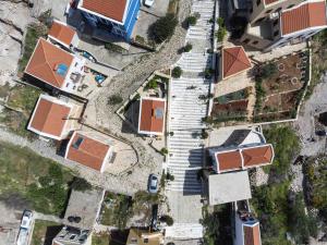 an overhead view of a yard with houses and buildings at Alexandros in Meyisti