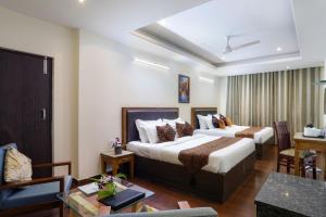 Letto o letti in una camera di Hotel SunGrace