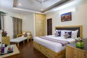 Letto o letti in una camera di Hotel SunGrace