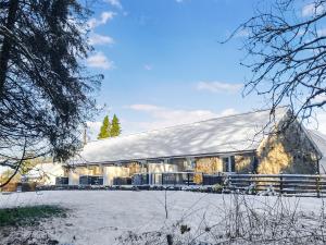 a large barn with snow on the ground at Owl Cottage in Llandeilo