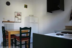 A kitchen or kitchenette at Rentoulia Apartments