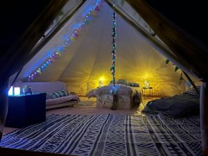 a room with a tent with a swing in it at Country View Camping in Bratton