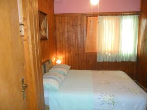 Postel nebo postele na pokoji v ubytování Apartmani Yucca
