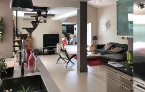 a living room with a couch and a table at La Villa De Sévigné in Rognonas +9 photos