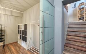 a walk in closet with glass doors and a staircase at Ferienwohnung In Luxusvilla in Bahrdorf +24 photos