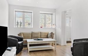 a living room with a couch and a table at Nice Apartment In Gilleleje in Gilleleje