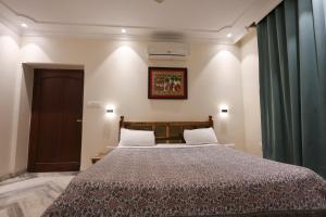 Postel nebo postele na pokoji v ubytování Gumaan Auberge