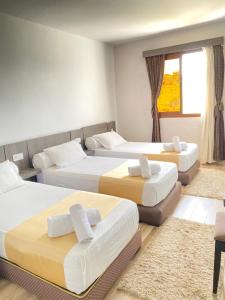 Postel nebo postele na pokoji v ubytování Hotel Chaouen