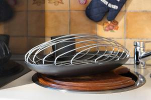 a metal bowl sitting on top of a kitchen counter at Apartment Seeadler in Butjadingen +12 photos