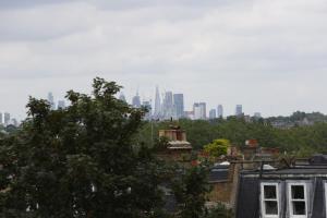 a view of a city skyline with buildings at Wimbledon Park Bed & Breakfast in London