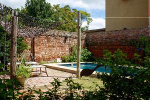 a bird standing next to a swimming pool at Antigua Casona Bed & Breakfast in San Antonio de Areco