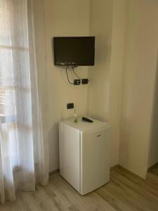 TV a/nebo společenská místnost v ubytování Casa Vacanza Le Case