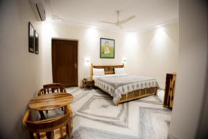 Postel nebo postele na pokoji v ubytování Gumaan Auberge