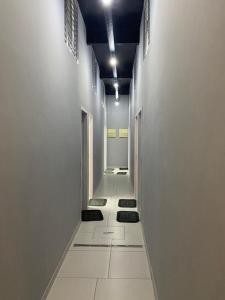 a long hallway with white walls and a white floor at 37 LOFT TRIPLO · Congonhas Airport, Jabaquara Metro, Expo São Paul in Sao Paulo