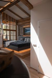 a bedroom with a bed and a window at Landhaus Maurer in Wagrain