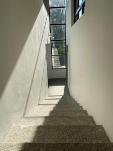 a staircase leading up to a window in a building at B1Verscio Villa Cavalli in Verscio