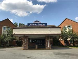 a building with a sign on top of it at Howard Johnson by Wyndham Newark Airport in Newark