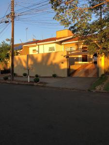 a house on the side of a street at Casa Térrea 3 quartos, sendo 1 suíte Maringá in Maringá