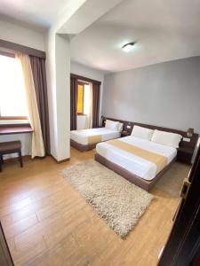 Postel nebo postele na pokoji v ubytování Hotel Chaouen