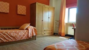 A bed or beds in a room at Leone de Castris Wine Hotel
