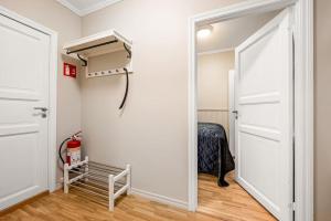 a door leading into a room with a closet at Kong Oscars gate 28 - 302 in Bergen