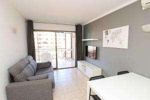 a living room with a couch and a table at DIFFERENTFLATS Costa d' Or II in Cambrils