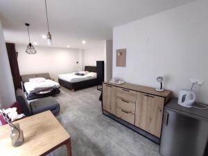 A bed or beds in a room at Symple apartments