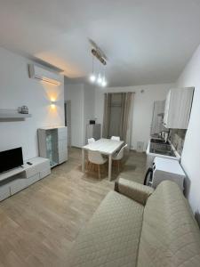 a living room with a couch and a table at A Casucc appartamenti in Peschici