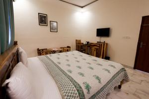 Postel nebo postele na pokoji v ubytování Gumaan Auberge