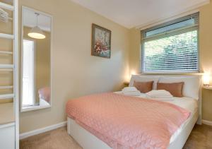 a bedroom with a bed and a window at Lingmoor Lookout in Chapel Stile