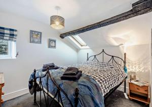 a bedroom with a bed in a room at Pear Tree Cottage - Solway Coast in Bowness-on-Solway