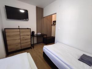 A bed or beds in a room at Symple apartments