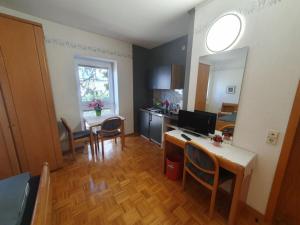 a kitchen and dining room with a table and chairs at 17 Apartments und 2 Suiten in Zwingenberg