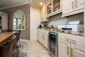 a kitchen with white cabinets and a counter top at Phoenix on the Bay 1307 condo in Orange Beach