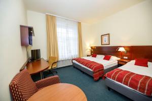 Letto o letti in una camera di Hotel Grand