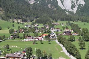 an aerial view of a village in the mountains at Hotel Pension Residence in Ramsau am Dachstein