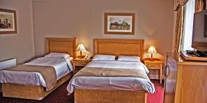 Postel nebo postele na pokoji v ubytování Gullane's Hotel