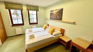 Posteľ alebo postele v izbe v ubytovaní Apartmán Aurora Třeboň