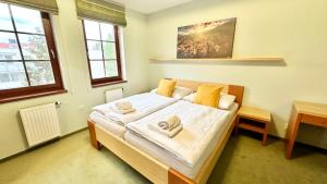 Posteľ alebo postele v izbe v ubytovaní Apartmán Aurora Třeboň