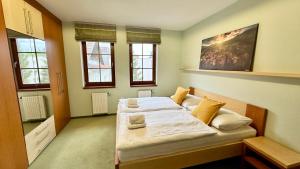 Posteľ alebo postele v izbe v ubytovaní Apartmán Aurora Třeboň