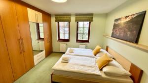 Posteľ alebo postele v izbe v ubytovaní Apartmán Aurora Třeboň