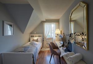 Postel nebo postele na pokoji v ubytování Hotel Schiff am See