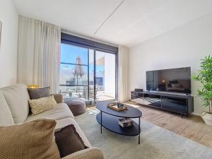 a living room with a couch and a tv at Los Alcazares Velapi - 3610 in San Javier