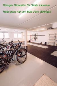 a room with a bunch of bikes parked in it at K1 Hotel Willingen in Willingen