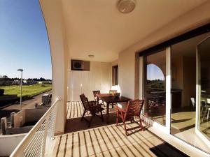 a balcony with a table and chairs on it at Oikia Vacanze Casa di Chica in Otranto