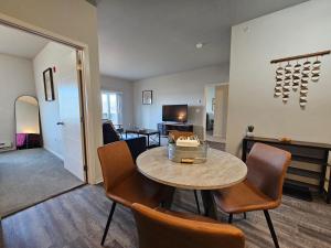 a living room with a table and chairs at HUGE Apartment, 2 Bedroom, 2 Bathroom, Park Free in Rochester