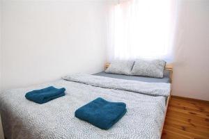 En eller flere senge i et værelse på Noclegi - Wyspa Słodowa
