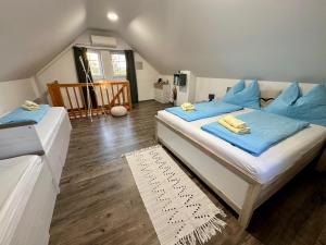 Postel nebo postele na pokoji v ubytování Apartmány & Vinařství Káňa