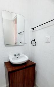 a bathroom with a sink and a mirror at Departamento en tulum Quintana roo in Tulum