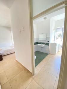 a bathroom with a sink and a toilet in a room at Abruzzi 81 in Lecce +20 photos